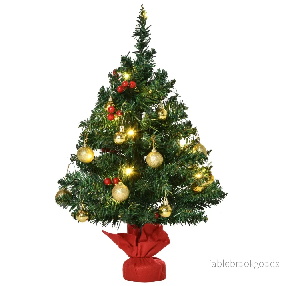 Liten grön julgran med LED-lampor och bär Liten grön julgran med LED-lampor och bär